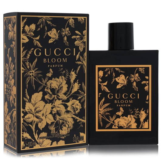 Gucci Bloom Parfum bottle and matching box, both in black with ornate gold floral and butterfly illustrations, on a white background 100ml