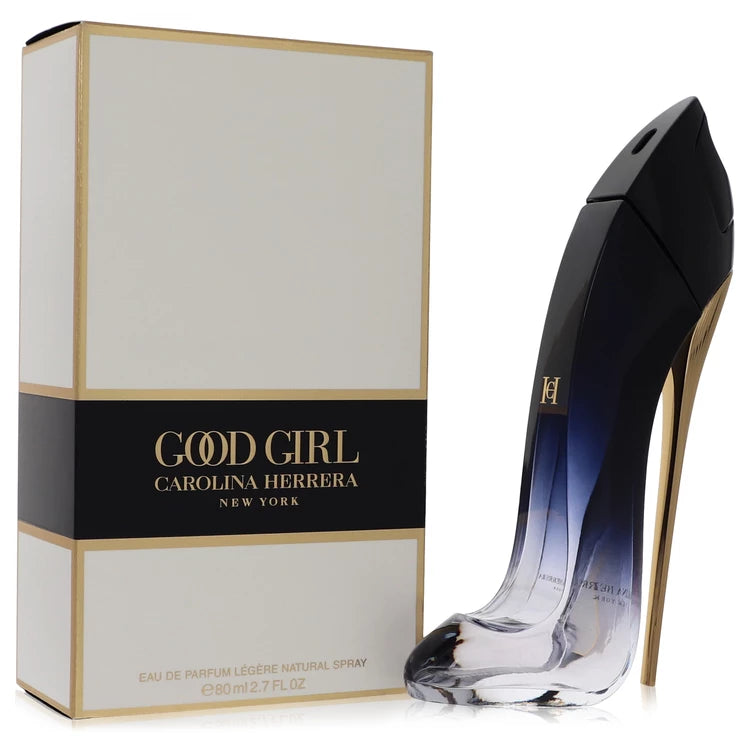 Bottle of Good Girl Légère by Carolina Herrera with gradient stiletto design, set against a soft floral and amber-toned background 80ml