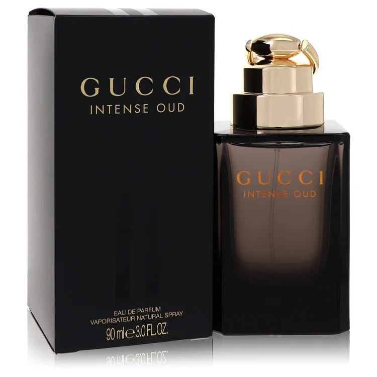 Bottle of Gucci Intense Oud Eau de Parfum with dark gold and black tones against a luxurious, smoky background 90ml