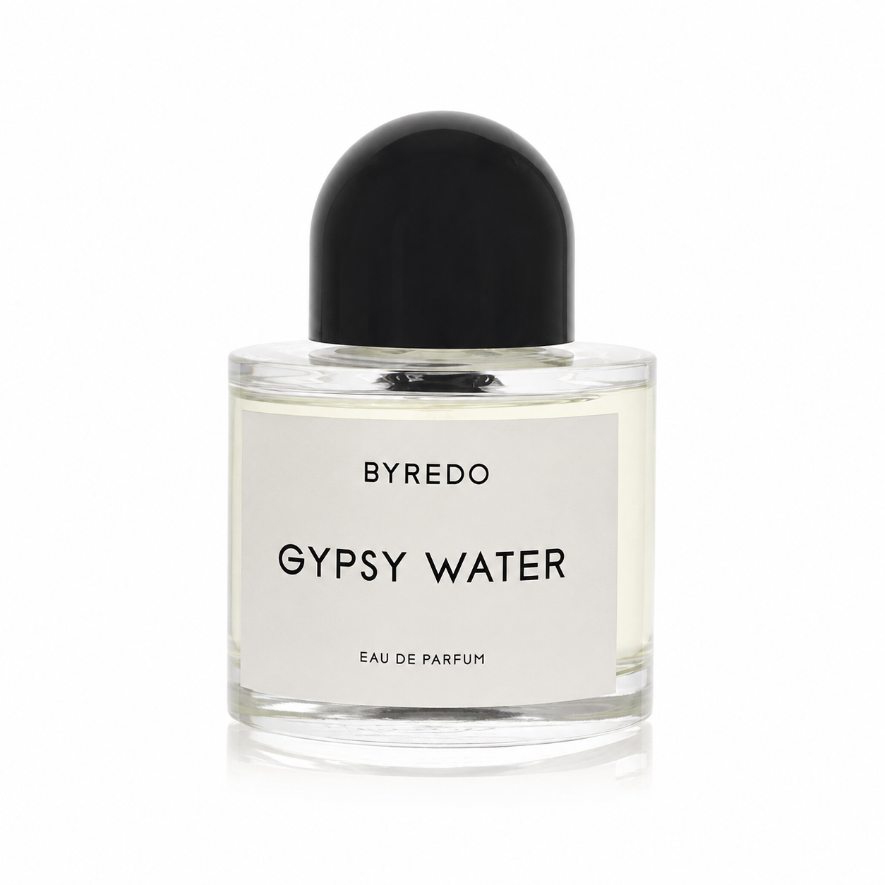 A bottle of Byredo Gypsy Water Eau de Parfum with a clear glass body, light beige liquid, a white label with black text, and a black dome-shaped cap, set against a plain white background.