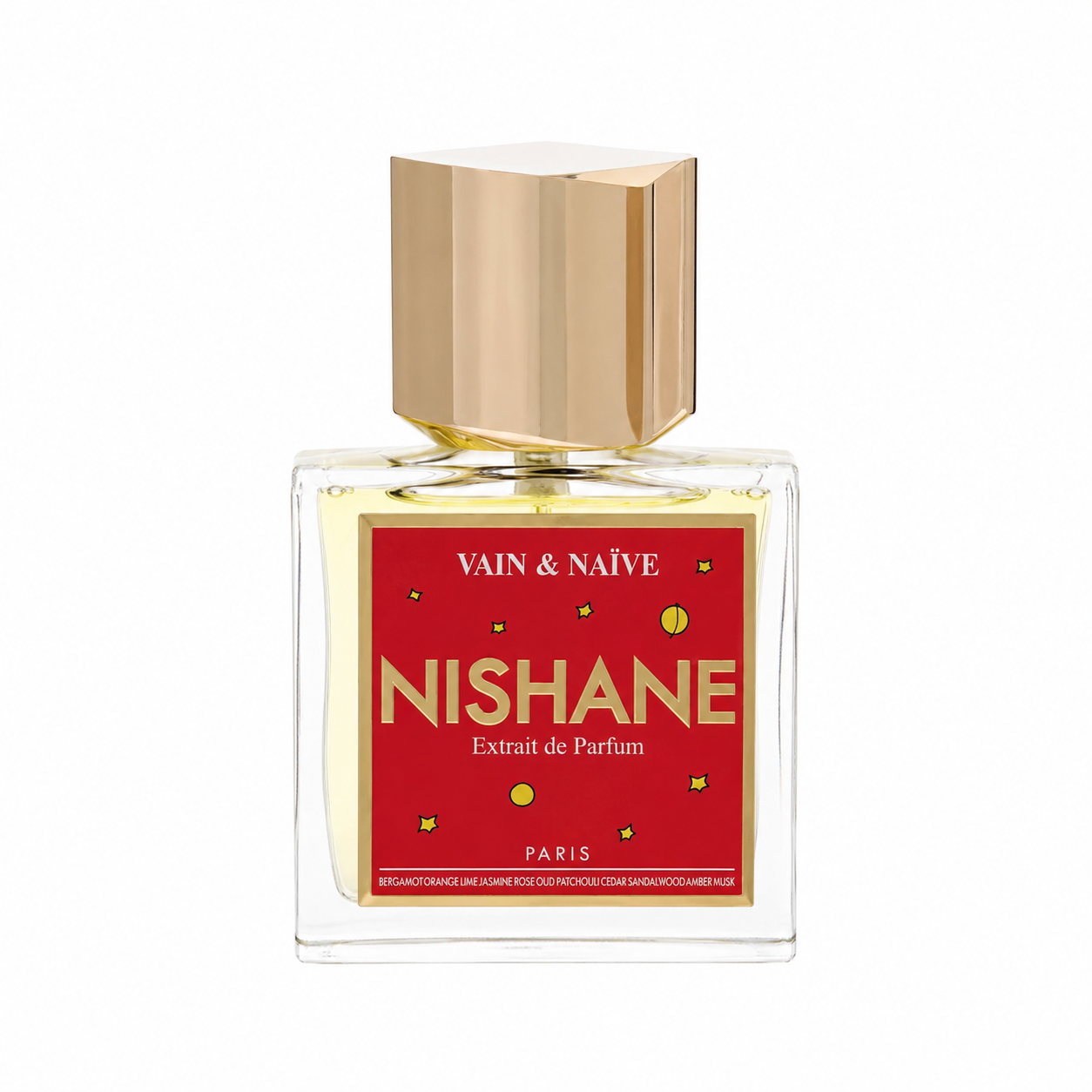 A bottle of Nishane Extrait de Parfum by Vain & Naïve, featuring a clear glass bottle with pale yellow liquid, a metallic gold cap, and a red label with gold lettering. 50ml