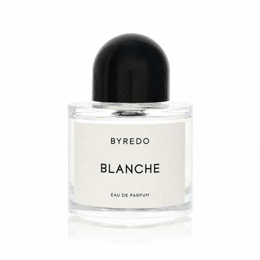 A bottle of Byredo Blanche Eau de Parfum with a clear glass body, white label, and a black dome-shaped cap, centered on a white background.