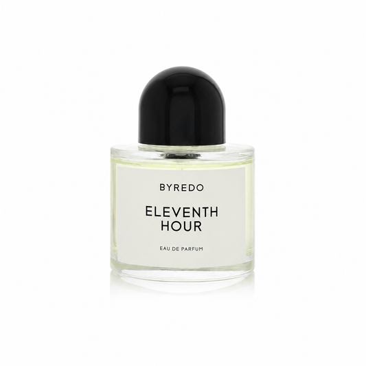Byredo Eleventh Hour Eau de Parfum in a clear glass bottle with a white label and a black dome-shaped cap, centered on a white background.