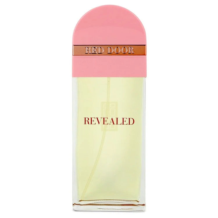 A bottle of Givenchy Revealed Red Door Eau de Parfum, featuring a pale yellow liquid in a clear rectangular bottle with a pink arched cap and a metallic bronze band labeled 'RED DOOR'. 100ml
