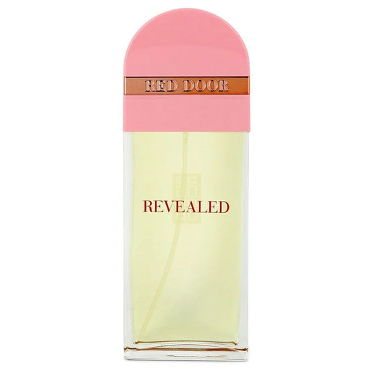 A bottle of Givenchy Revealed Red Door Eau de Parfum, featuring a pale yellow liquid in a clear rectangular bottle with a pink arched cap and a metallic bronze band labeled 'RED DOOR'. 100ml