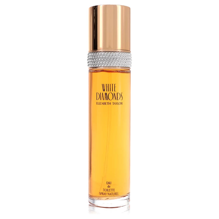 Elizabeth Taylor White Diamonds Eau de Toilette perfume bottle with amber-colored liquid, a metallic rose gold cap, and a silver rhinestone band, shown on a white background. 100ml