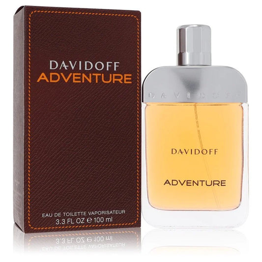 Bottle of Davidoff Adventure Eau de Toilette for Men with natural wood, spice, and mountain-themed background 100ml
