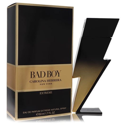 Gold-accented lightning bolt bottle of Carolina Herrera Bad Boy Extreme Eau de Parfum with fiery, smoky background 50ml