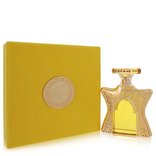Gold perfume bottle and box with decorative design on a white background 100ml
