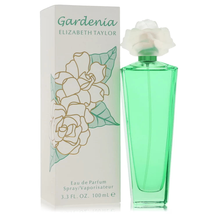 Green perfume bottle with white flower and packaging featuring floral design on a white background 100ml