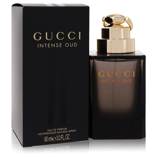 Bottle of Gucci Intense Oud Eau de Parfum with dark gold and black tones against a luxurious, smoky background 90ml