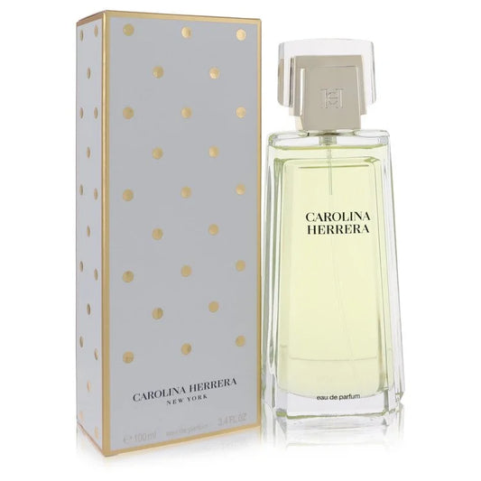 Bottle of Carolina Herrera Eau de Parfum for Women with a classic white floral arrangement and a glamorous evening setting 100ml