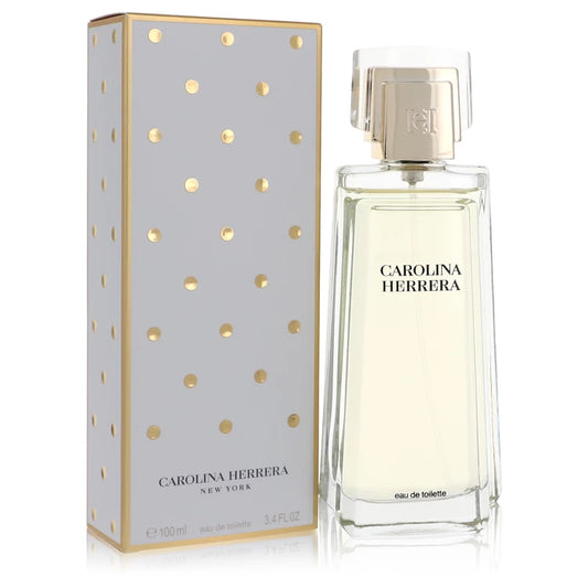 Bottle of Carolina Herrera Eau de Parfum for Women with a classic white floral arrangement and a glamorous evening setting 100ml