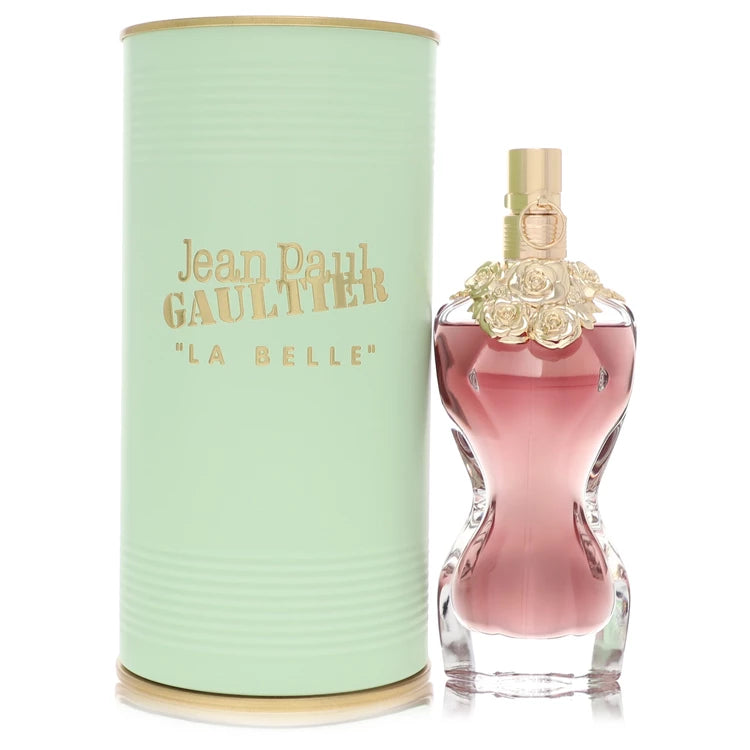 Jean Paul Gaultier La Belle Eau de Parfum bottle next to its mint green cylindrical packaging box with gold lettering, on a white background. 50ml