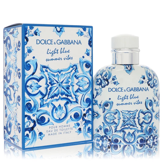 Bottle of Dolce & Gabbana Light Blue Summer Vibes for Men Eau de Toilette 100ml with lemon and cypress background