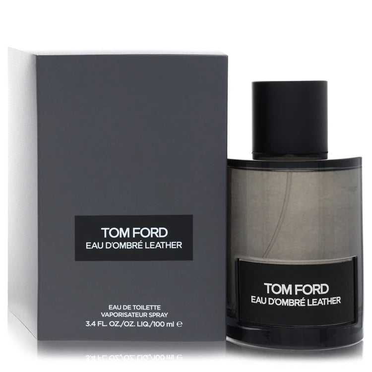 Tom Ford Eau d'Ombré Leather Eau de Toilette luxury fragrance in a translucent amber glass bottle with a black label, featuring warm leather, vanilla, ginger, cardamom and sandalwood. 100ml