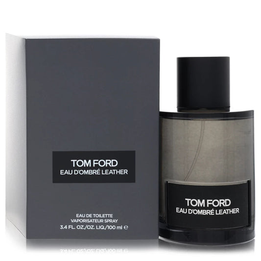 Tom Ford Eau d'Ombré Leather Eau de Toilette luxury fragrance in a translucent amber glass bottle with a black label, featuring warm leather, vanilla, ginger, cardamom and sandalwood. 100ml