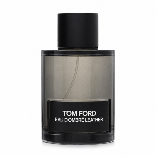 Tom Ford Eau d'Ombré Leather Eau de Toilette luxury fragrance in a translucent amber glass bottle with a black label, featuring warm leather, vanilla, ginger, cardamom and sandalwood. 100ml
