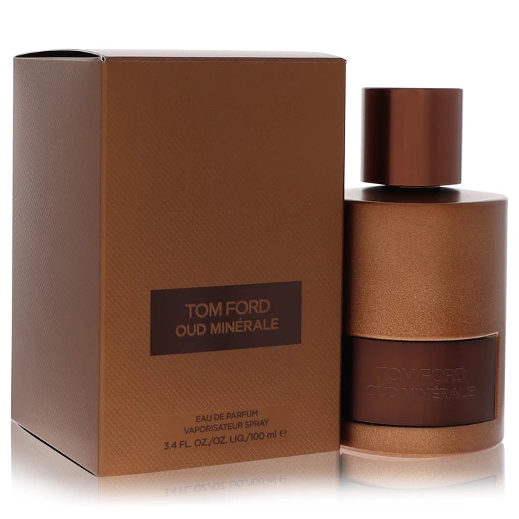 Tom Ford Oud Minérale Eau de Parfum unisex fragrance in a dark grey glass bottle with a black cap and metallic label, featuring marine notes, pink pepper, oud, fir balsam, and ambergris. 100ml