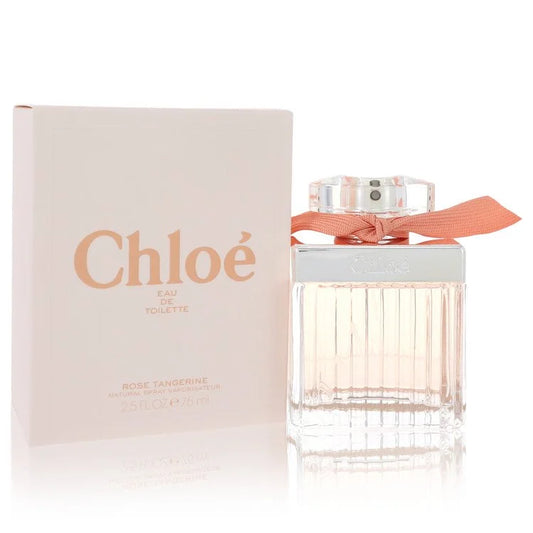 Bottle of Chloé Roses Tangerine Eau de Toilette with rose petals and fresh tangerines in a soft, floral setting 75ml
