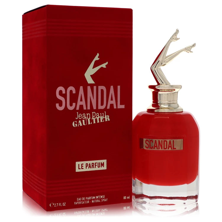 Red 'Scandal' perfume bottle and packaging by Jean Paul Gaultier on a white background