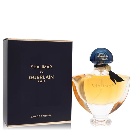 Bottle of Guerlain Shalimar Eau de Parfum surrounded by rich gold and deep oriental tones 50ml