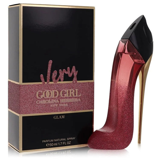 Bottle of Very Good Girl Glam by Carolina Herrera in sparkling red stiletto design with cherry and rose accents in a glamorous setting 50ml